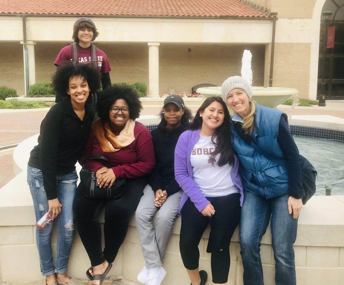FACES members and officers (from left to right) Shantell Batiste, Valerie Ramirez, Destiny Aguinaga, Amber Alston, Ranisha Dokes and Dr. Norton sit outside Flowers Hall.