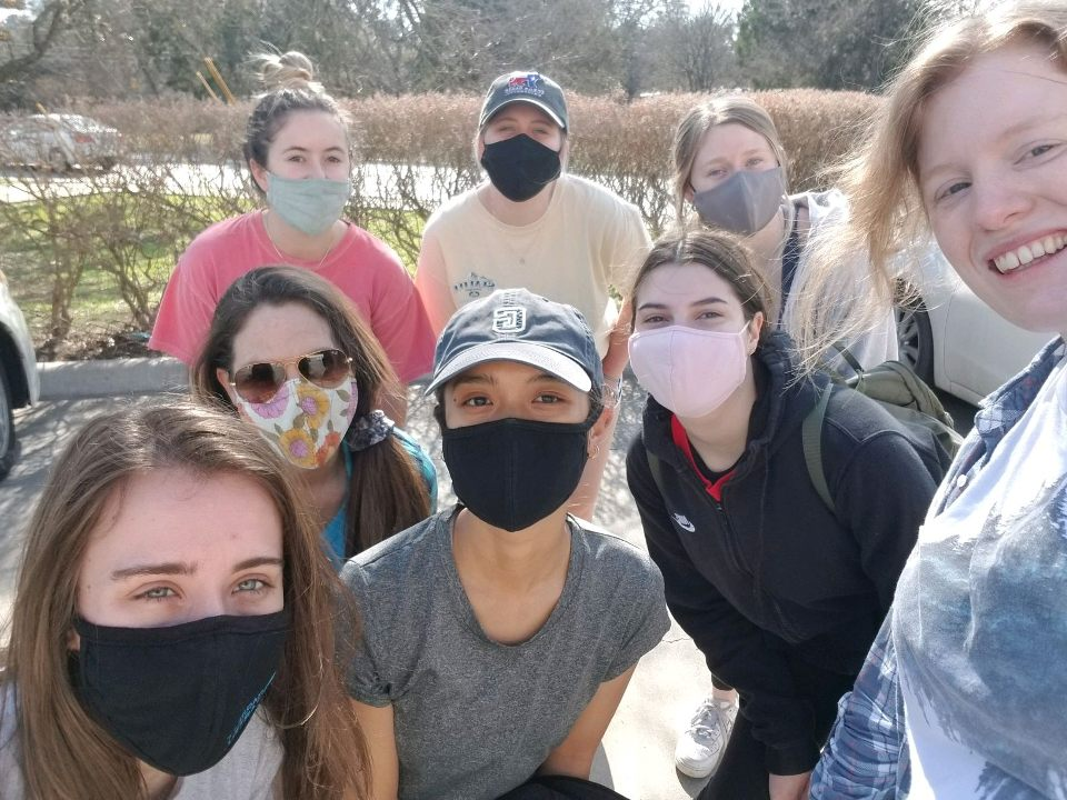 Members of Women In Business smile for a photo at the San Marcos River Clean-Up, Saturday, March 6 2021.