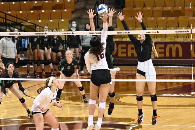 Texas+State+junior+outside+hitter+Janell+Fitzgerald+%2816%29+attempts+to+spike+the+ball+over+the+net%2C+Thursday%2C+March+25%2C+2021%2C+at+Strahan+Arena.+The+Bobcats+won+3-0.