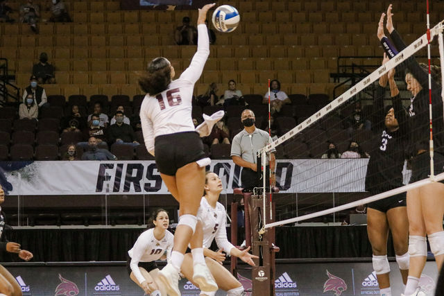 Texas State junior outside hitter Janell Fitzgerald (16) prepares to hit the ball around incoming TCU blockers, Thursday, March 18, 2021, at Strahan Arena. The Bobcats lost 3-1.