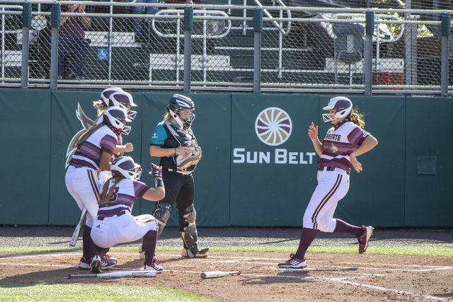 Texas+State+senior+outfielder+Arieann+Bell+%2819%29+is+greeted+by+her+teammates+at+home+base+after+a+home+run%2C+Thursday%2C+April+1%2C+2021%2C+at+Bobcat+Softball+Stadium.+Texas+State+defeated+Coastal+Carolina+6-5+in+the+first+game+of+a+three-game+series.
