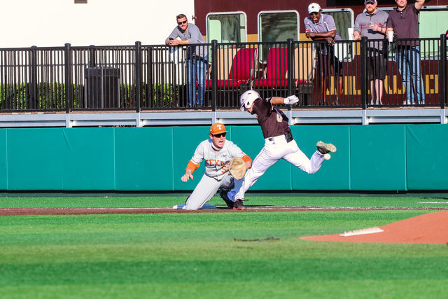 Texas+State+junior+infielder+Dalton+Shuffield+%288%29+lands+on+the+base+before+the+Longhorns+can+get+the+ball+to+their+first+baseman%2C+Tuesday%2C+April+20%2C+2021%2C+at+Bobcat+Ballpark.+The+Bobcats+lost+5-1.