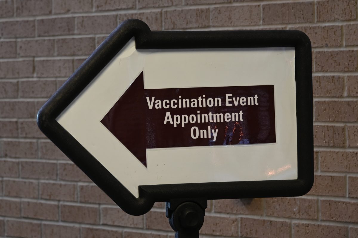 A+sign+points+patients+toward+the+vaccine+event+sign+in%2C+Friday%2C+March+12%2C+2021%2C+the+LBJ+Student+Center.