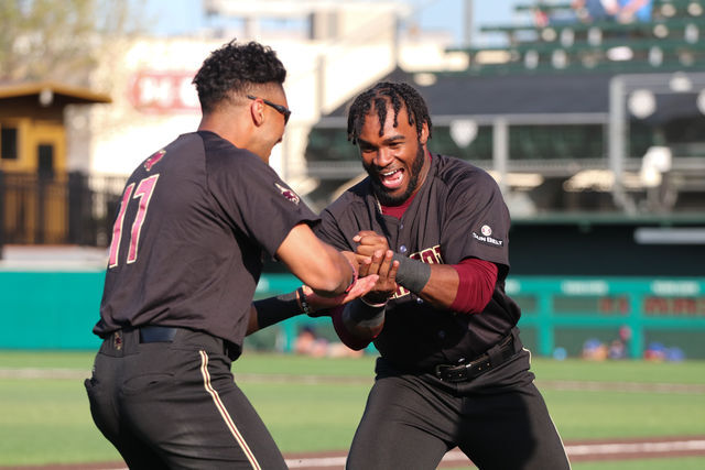 Texas State sophomore outfielder Ben McClain (19) and junior outfielder Isaiah Ortega-Jones (17) play rock-paper-scissors before the game against UTA, Thursday, April 1, 2021, at Bobcat Ballpark. The Bobcats won 2-0.