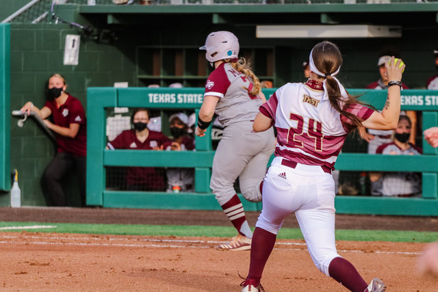 Texas+State+freshman+infielder+Baylee+Lemons+%2824%29+throws+the+ball+to+first+base+in+an+attempt+to+get+the+A%26amp%3BM+batter+out%2C+Tuesday%2C+April+6%2C+2021%2C+at+Bobcat+Softball+Stadium.+The+Bobcats+won+7-6.