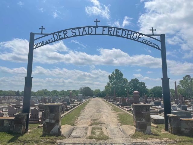 Graves at the front entrance of Der Stadt Friedhof Cemetery, Saturday, May 8, 2021, in Fredericksburg, Texas.