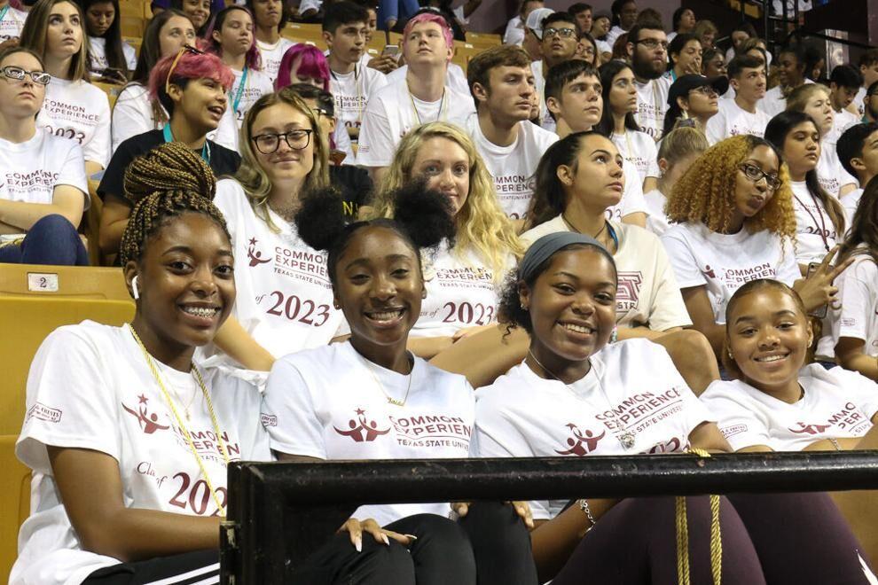 Texas State Class of 2023 students smile for a photo in their Common Experience t-shirts, Saturday, Aug. 24, 2019, at Strahan Coliseum.