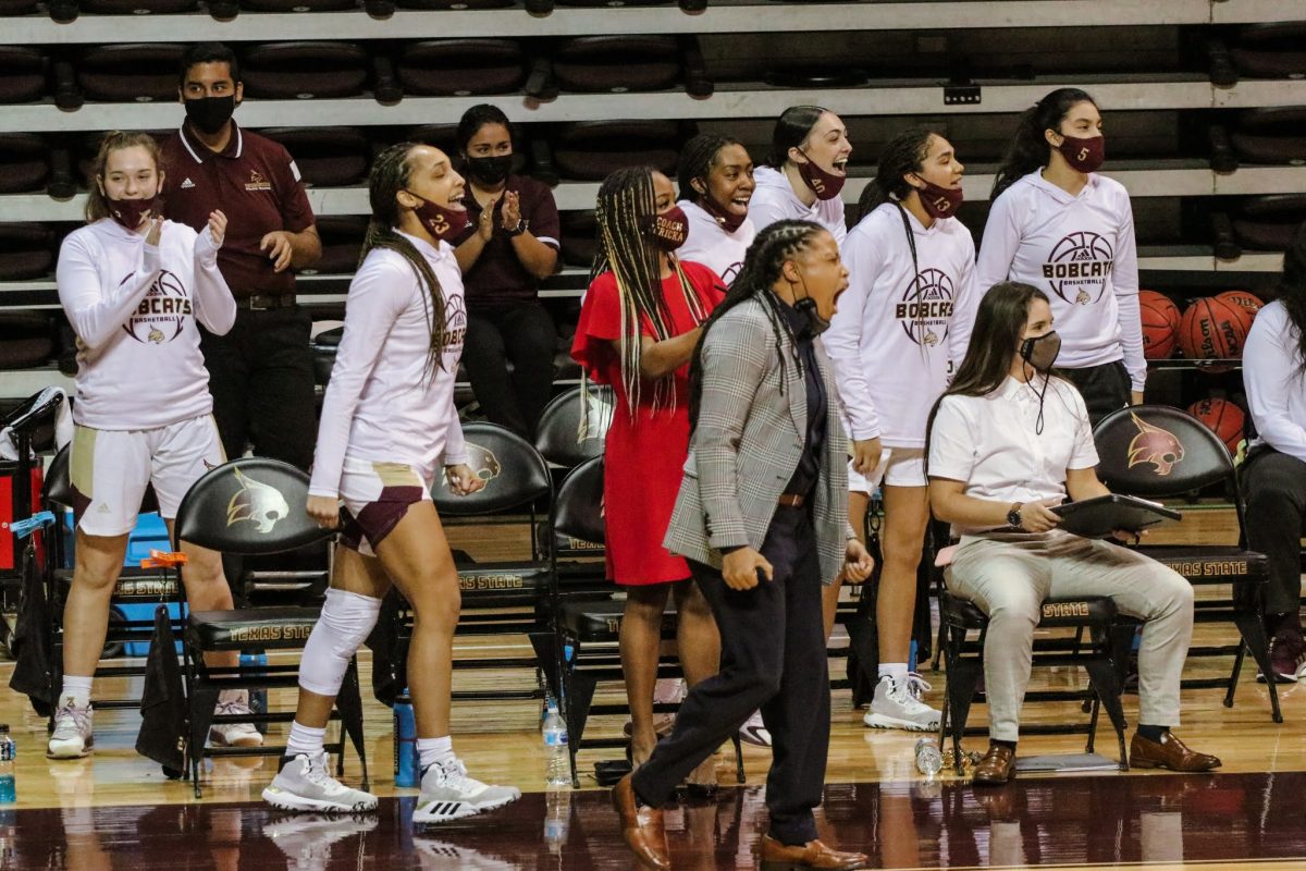 Bobcat+players+and+staff+celebrate+after+taking+the+lead+over+the+University+of+Texas+Arlington%2C+Friday%2C+Feb.+12%2C+2021%2C+at+Strahan+Arena.+The+Bobcats+won+66-45.
