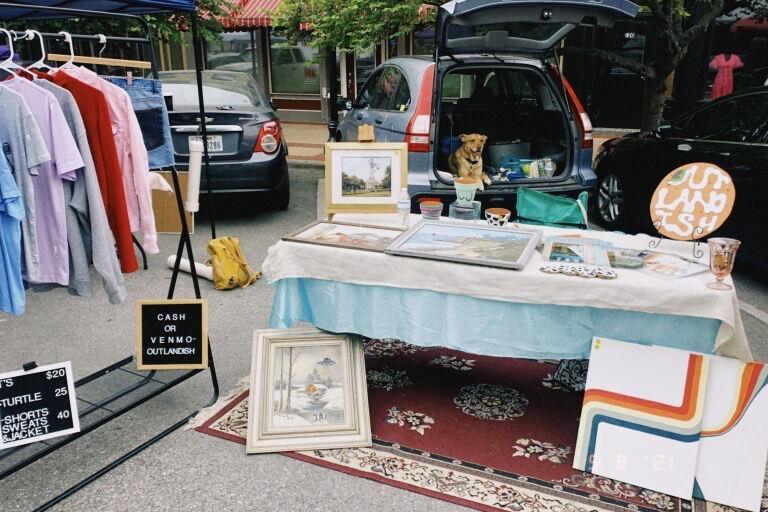 Outlandish Co., a local small business selling a range of clothing and home decor, sets up its stand Sunday, May 2021 at the San Marcos Farmers Market.