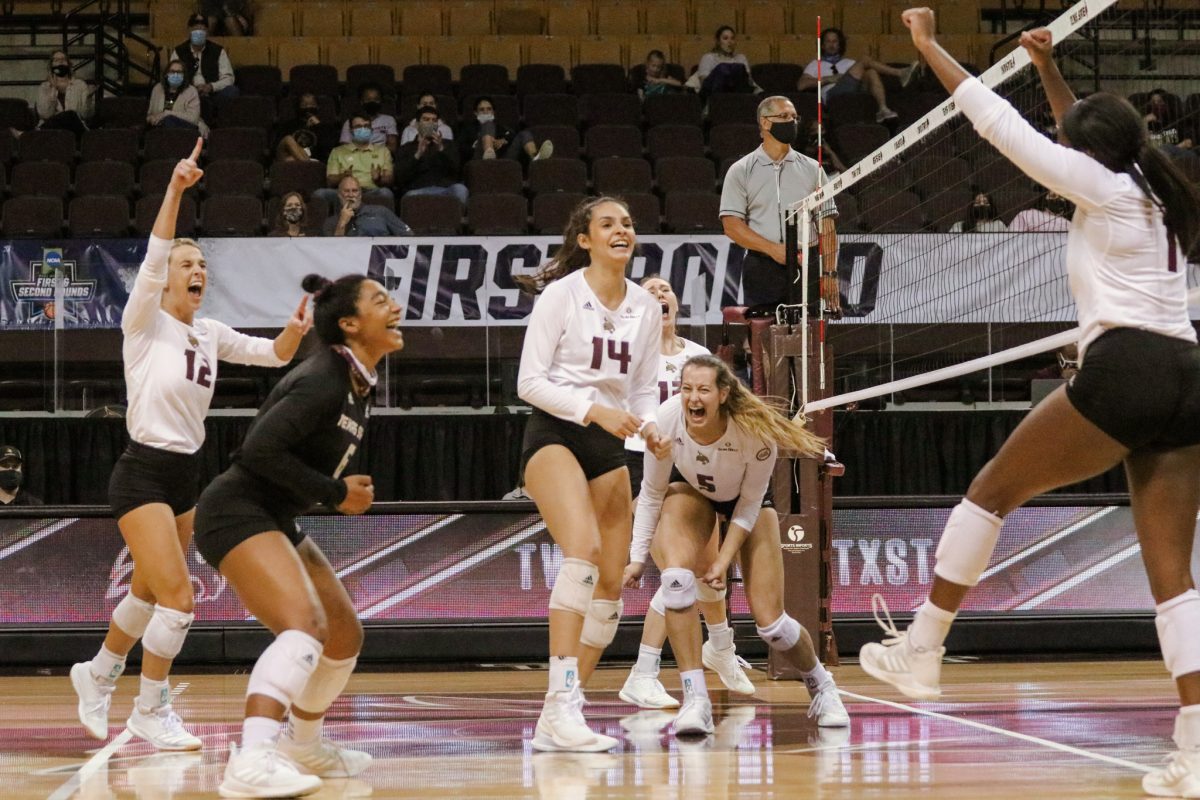 The+Bobcats+celebrate+following+a+kill+from+Texas+State+then-junior+outside+hitter+Kenedi+Rutherford+%281%29+during+the+second+set+against+TCU%2C+Thursday%2C+March+18%2C+2021%2C+at+Strahan+Arena.+The+Bobcats+lost+3-1.