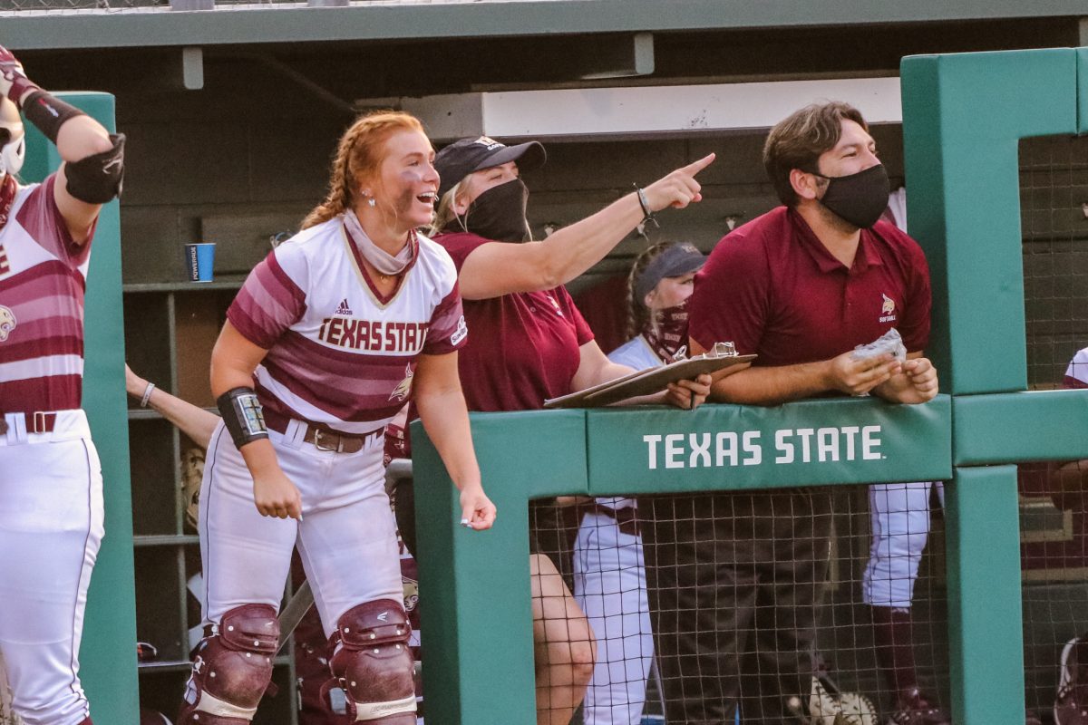 Texas+State+players+and+staff+cheer+from+the+dugout+as+the+Bobcats+score+their+only+run+of+the+game+against+South+Alabama%2C+Friday%2C+April+9%2C+2021%2C+at+Bobcat+Softball+Complex.+The+Bobcats+lost+3-1.