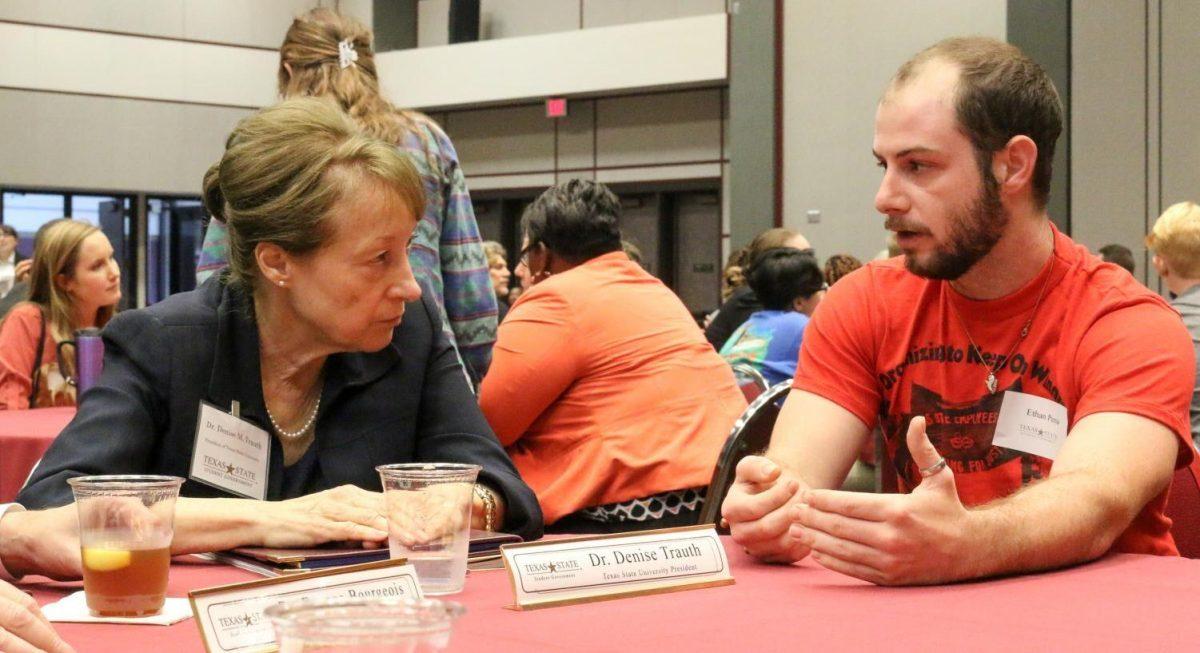 Texas State University President Denise Trauth speaks with student Ethan Pena Sept. 30, 2019, at the Student Government Roundtable in the LBJ Ballroom.