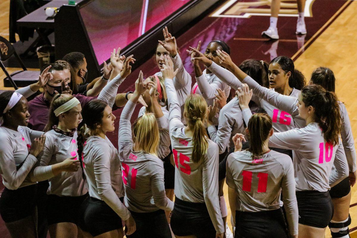 Texas State volleyball gathers in a huddle during a timeout against the University of Arkansas at Little Rock, Friday, Oct. 23, 2020, at Strahan Arena. The Bobcats won 3-1.