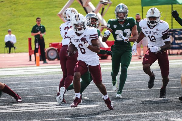 Texas State Donnovan Moorer (6) sprints with the ball upfield following Eastern Michigan return, Saturday, Sept. 25, 2021, at Rynearson Stadium. The Bobcats lost 59-21.