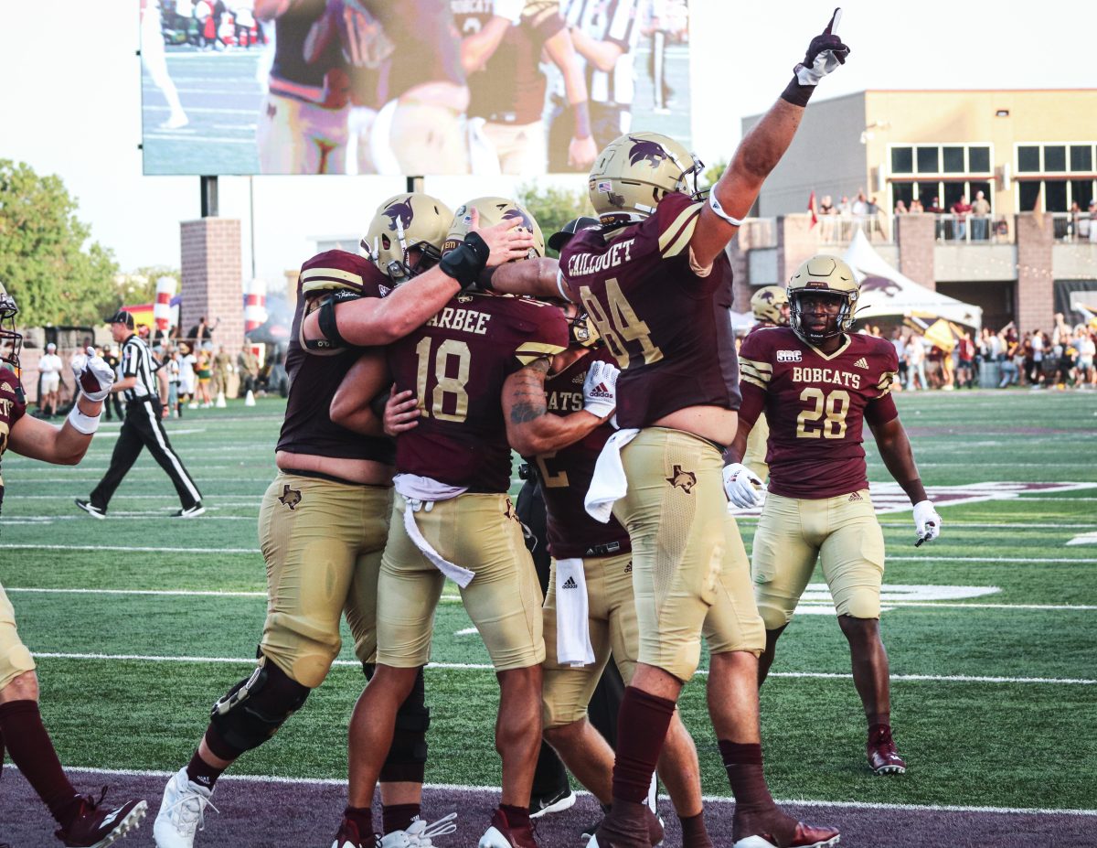 Bobcat+teammates+celebrate+with+junior+wide+receiver+Marcell+Barbee+%2818%29+after+scoring+a+touchdown+over+Baylor+in+the+second%2C+Saturday%2C+Sept.+4%2C+2021%2C+at+Bobcat+Stadium.+The+Bobcats+lost+29-20.