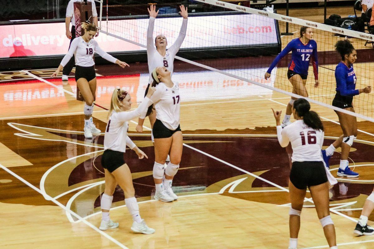 The Texas State volleyball team celebrates after scoring the match point and beating the University of Texas Arlington 3-0, Friday, Nov. 13, 2020, at Strahan Arena.