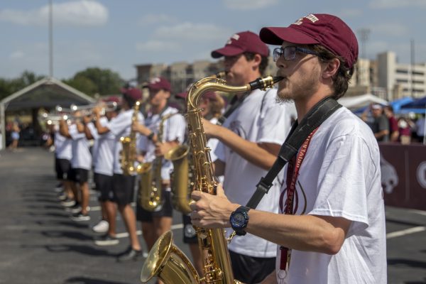 The Texas State Bobcat Marching Bands performs at the Cat Walk during the tailgate before the Texas State and Baylor football game, Saturday, Sept. 4, 2021, at Bobcat Stadium.