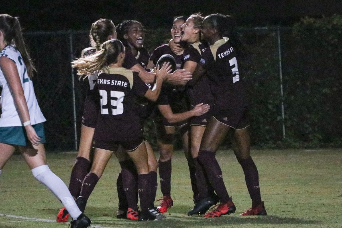 The Bobcat soccer players embrace each other as they celebrate their 2-1 overtime win against Coastal Carolina, Thursday, Sept. 16, 2021, at Bobcat Soccer Complex.