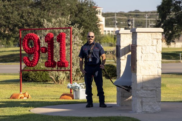 A San Marcos firefighter rings the bell in memory of the lives lost on 9/11 during the 20 Year Remembrance Ceremony, Saturday, Sept. 11, 2021, at City Hall.