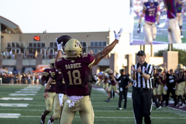 Texas State junior wide receiver Marcell Barbee (18) tosses the ball to the referee after scoring a touchdown against Baylor, Saturday, Sept. 4, 2021, at Bobcat Stadium. The Bobcats lost to Baylor 29-20.