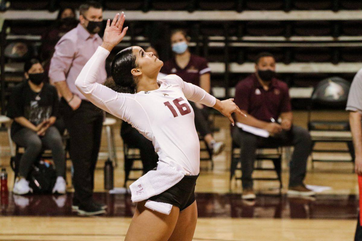 Texas State junior outside hitter Janell Fitzgerald (16) prepares to serve the ball to the waiting Baylor defense during the game, Wednesday, March 10, 2021, at Strahan Arena. The Bobcats lost 3-0.