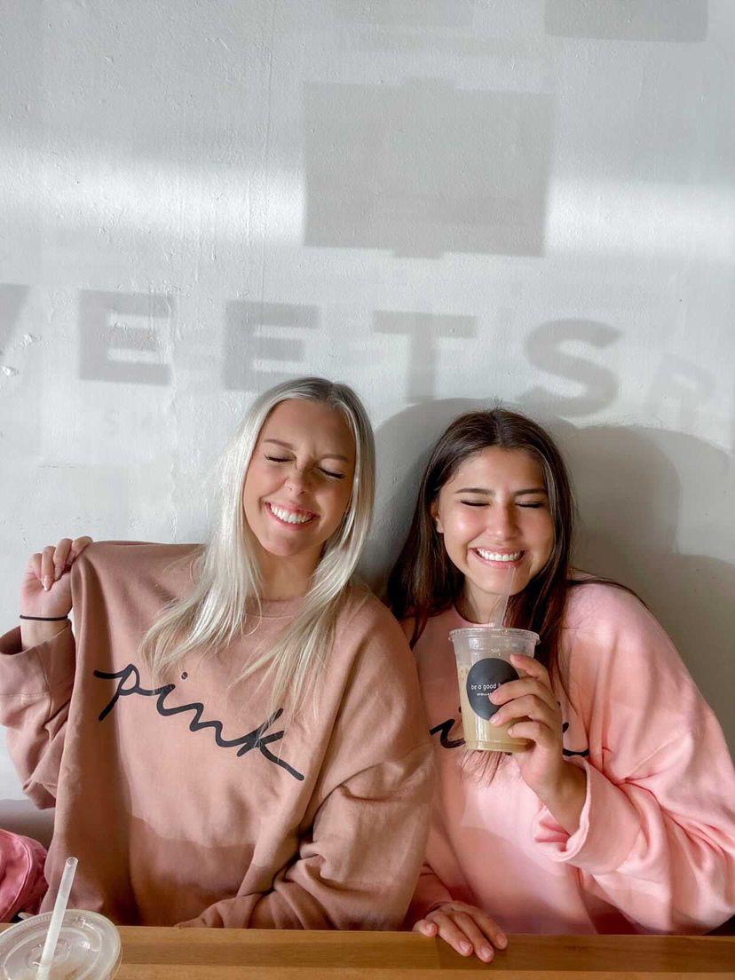 Texas State PINK campus reps Kassidee Ryder and Kiarra Regalado show off their PINK gear in August at Stellar Coffee Co.