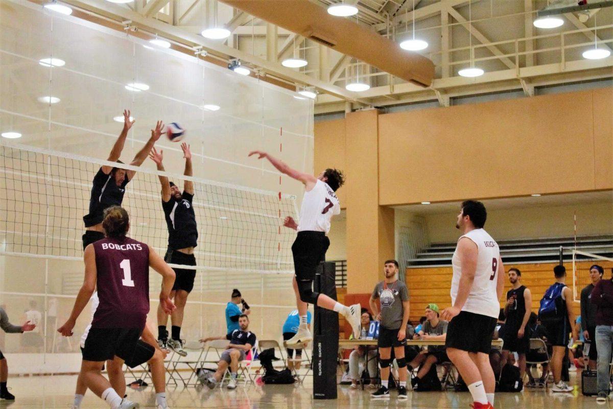 Texas State senior mens volleyball player Ben Simon (7) spikes the ball in a match, Saturday, Sept. 28, 2019, at the University of Texas.