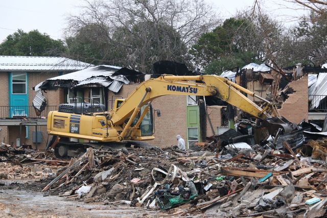 Workers demolish the burned Iconic Village apartments, Tuesday, Jan. 15, 2020 on North LBJ Drive. An early-morning apartment complex fire on July 20, 2019, left five residents deceased and hundreds displaced.