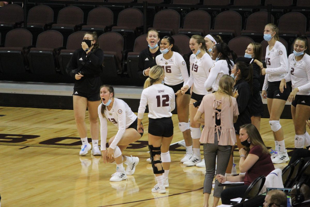 Texas State Volleyball team members celebrate on the sideline after a block during a game against the University of Alabama, Friday, Sept. 10, 2021, at Strahan Arena. The Bobcats won 3-1 against the University of Alabama.