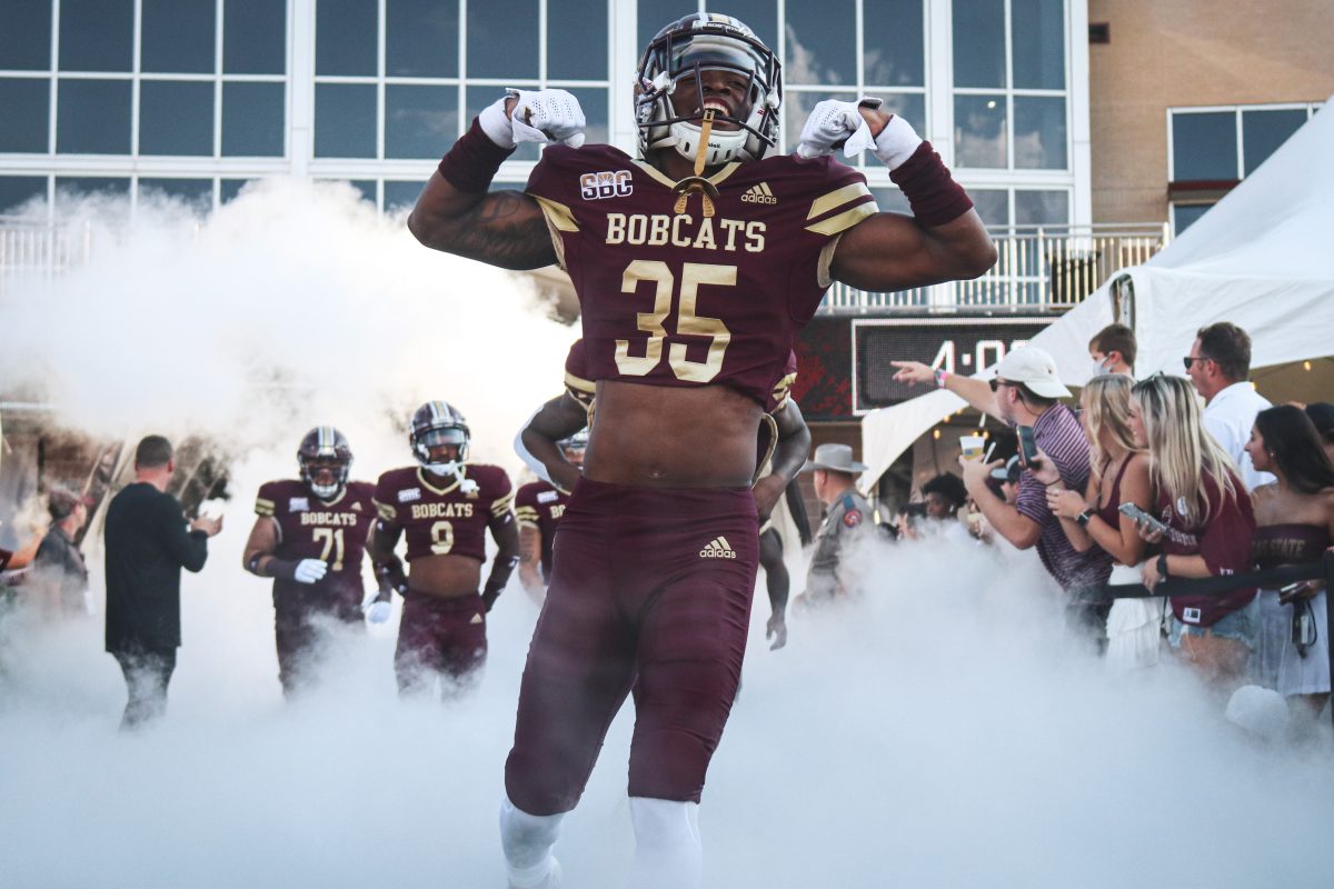 Texas State sophomore cornerback Ashton Johnson (35) runs through the smoke-filled tunnel to the field before the game against the University of the Incarnate Word begins, Saturday, Sept. 18, 2021, at Bobcat Stadium. The Bobcats lost 42-34.