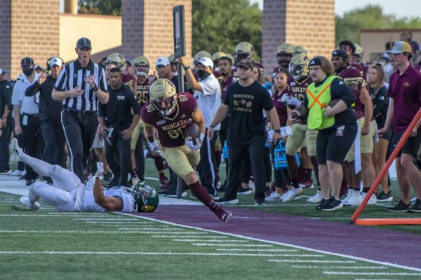 Texas State junior wide receiver Chanlder Speights (80) gets knocked out of bounds after getting a first down, Saturday, Sept. 4, 2021, at Bobcat Stadium. The Bobcats lost to Baylor 29-20.