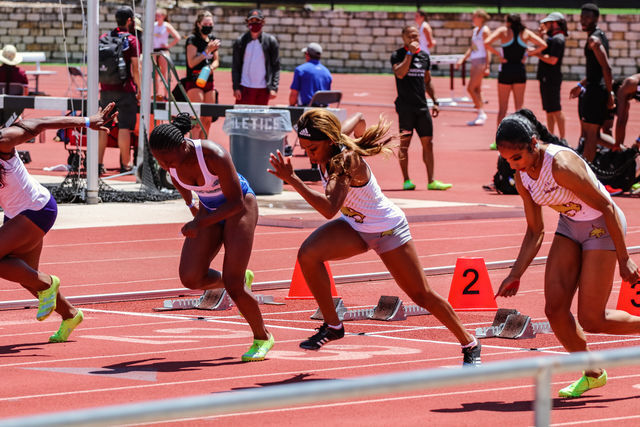 Texas State junior sprinter Sadi Giles and junior jumper/sprinter Shelby Smith take off during the 100 meter dash at the Bobcat Classic, May 2, 2021, at Texas State Track and Field Complex.