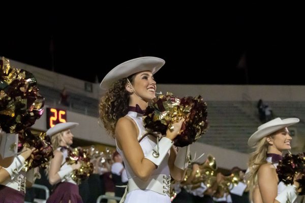 Texas State Strutters lieutenant Mikayla Anding cheers the Bobcats on from the sidelines, Saturday, Oct. 9, 2021, at Bobcat Stadium. The Bobcats defeated the South Alabama Jaguars 33-31.