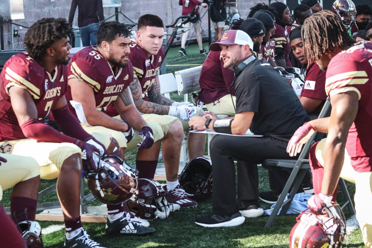 Texas State defensive coordinator Zac Spavital talks to defensive players on the sidelines during the game against the Troy Trojans, Saturday, Oct. 16, 2021, at Bobcat Stadium. The Bobcats lost 31-28.