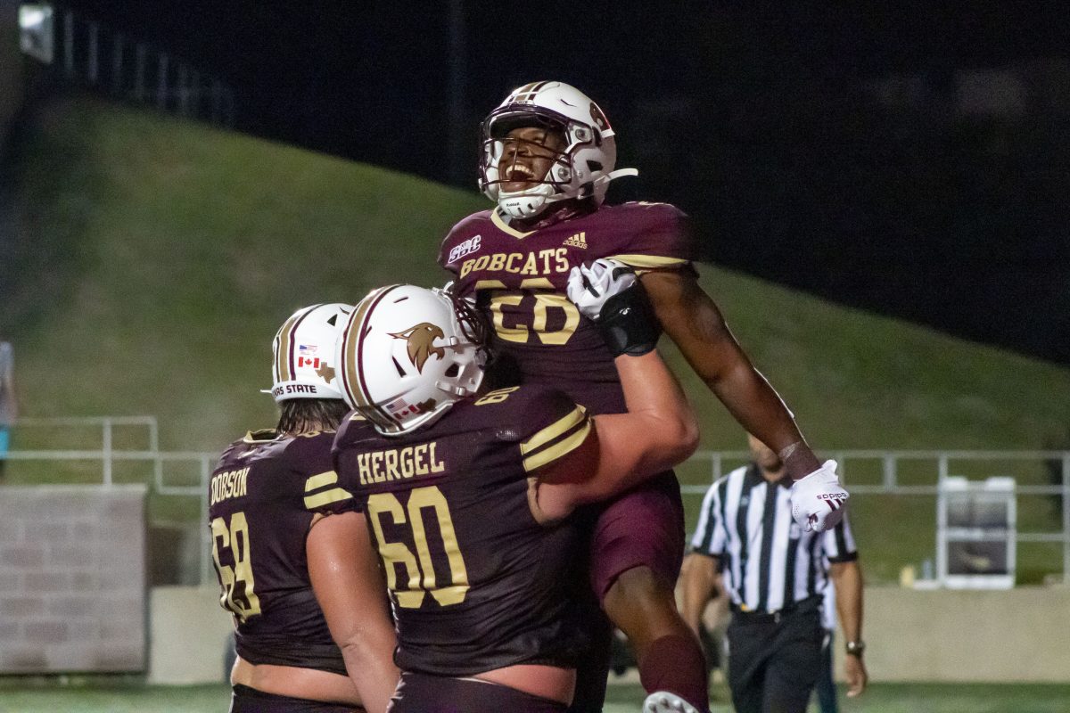 Texas State sophomore running back Jahmyl Jeter (28) celebrates with his teammates after scoring a touchdown, Saturday, Oct. 9, 2021, at Bobcat Stadium. The Bobcats defeated the South Alabama Jaguars 33-31.