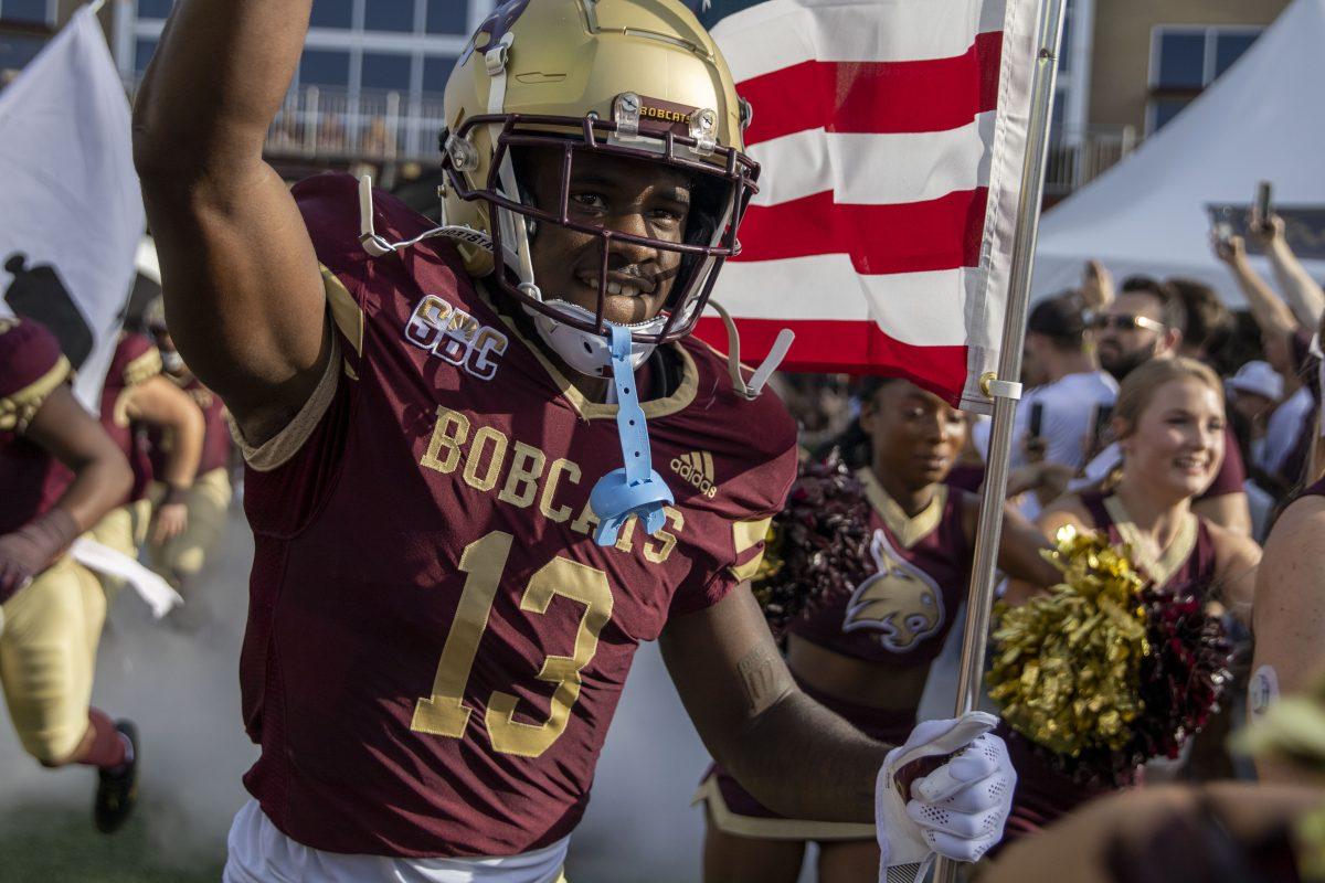 Texas State sophomore safety DeJordan Mask (13) runs onto the field for the kickoff of the first game of season, Saturday, Sept. 4, 2021, at Bobcat Stadium. Texas State lost to Baylor 29-20.