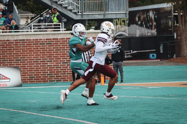 Texas State junior wide receiver Marcell Barbee (18) gets past a Coastal Carolina defender to score a touchdown, Saturday, Nov. 20, 2021, at Brooks Stadium.