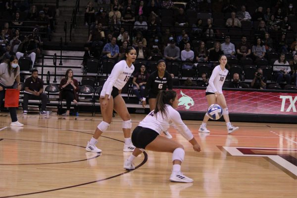 Texas State sophomore defensive specialist Kayla Tello (22) passes up the ball after receiving a serve from Arkansas State, Sunday, Nov. 7, 2021, at Strahan Arena. The Bobcats won 3-0.