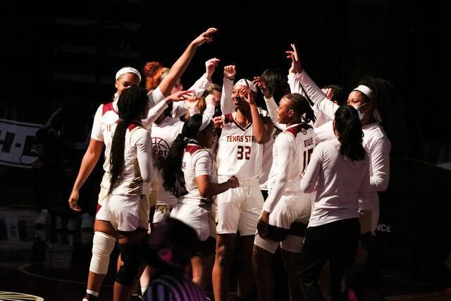 Texas State womens basketball team huddles together before they begin their game against the University of Texas at Arlington, Friday, Feb. 12, 2021, at Strahan Arena.