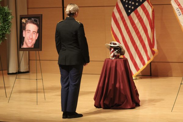 Cadet Maddie Smith pays respects to Austin Salyer during a celebration of life ceremony hosted by the Texas State Army ROTC and the Military Science Department, Friday, Nov. 12, 2021, at the Performing Art Center’s Recital Hall. 