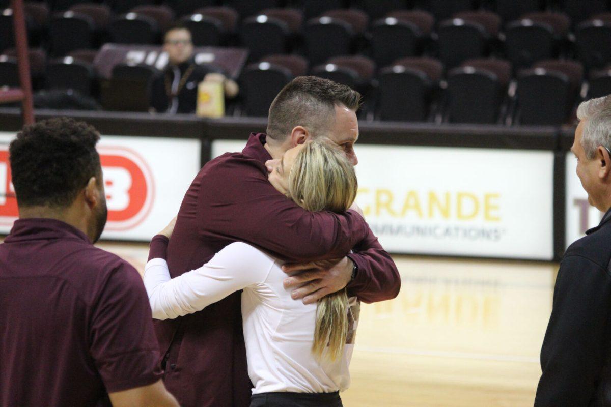 Texas State senior defensive specialist Brooke Johnson (12) hugs Head Coach Sean Huiet during Senior Day, Sunday, Nov. 7, 2021, at Strahan Arena.