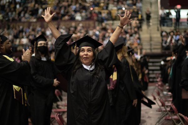 Texas State graduates celebrate at the end of the ceremony, Saturday, Dec. 11, 2021, at Strahan Arena.