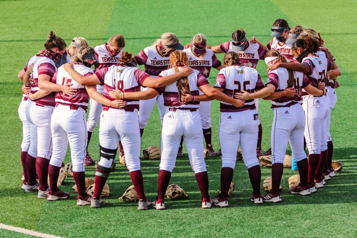 The Bobcat softball team huddles together before the game against Texas A&M, Tuesday, April 6, 2021, at Bobcat Stadium. The Bobcats won 7-6.