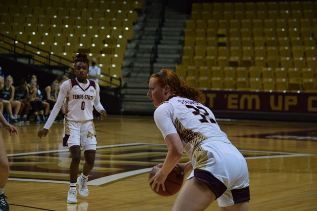 Texas State graduate guard/forward Gabby Standifer (33) looks to pass the ball to her teammate during a game against Dartmouth College, Thursday, Dec. 16, 2021, at Strahan Arena. The Bobcats lost 62-39.