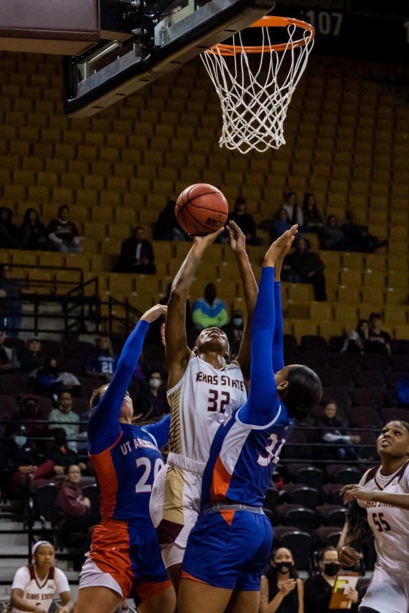Texas State senior forward DaNasia Hood (32) attempts a jumper underneath the basket during a game against UT Arlington, Saturday, Jan. 22, 2022, at Strahan Arena. The Bobcats lost 72-65.
