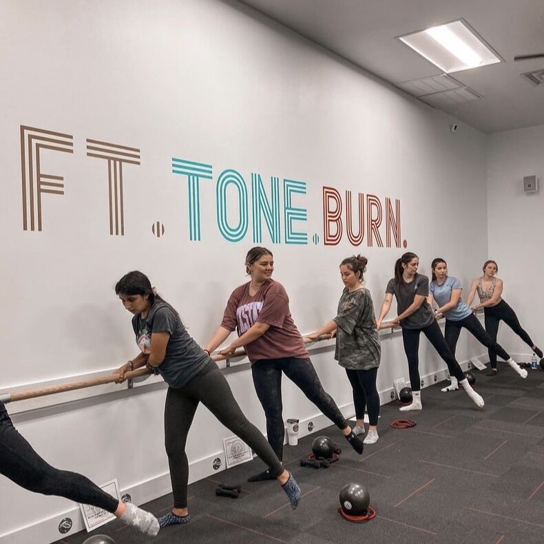 Members of the Texas State CHAARG chapter take part in a group barre class, Tuesday, Feb. 8, 2022 at Pure Barre in San Marcos.