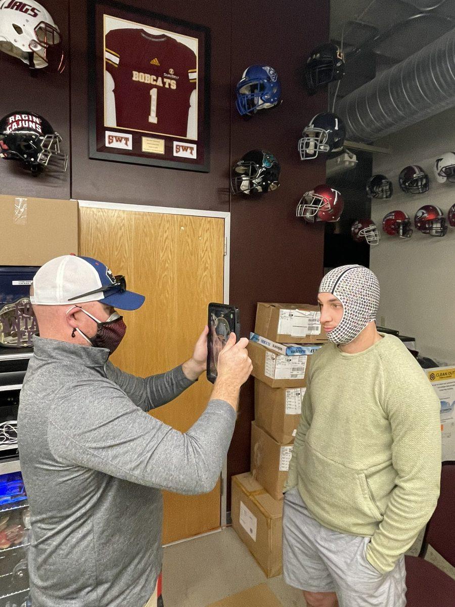 A Texas State football player receives a head scan for a custom fit of the Riddell Axiom helmet. The Riddell Axiom is produced on an athlete-to-athlete basis and helps improve impact response to prevent head injury.
