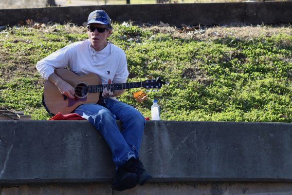 Rick Emery plays guitar, Thursday, Feb. 10, 2022, at Sewell Park.