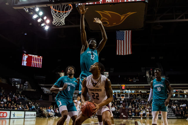 Texas State senior guard Nighael Ceaser (22) goes for a shot underneath the basket in a game against Coastal Carolina, Sat. Feb 5, 2022, at Strahan Arena. The Bobcats won 69-64.