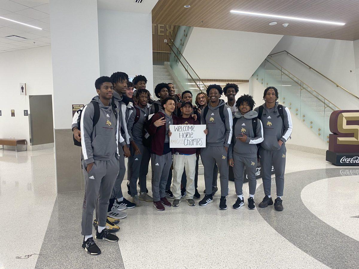 Texas State mens basketball smiles for a photo on Saturday, Feb. 26, 2022, inside the University Events Center. The team had just returned to San Marcos after securing its second consecutive Sun Belt Regular-Season Championship.